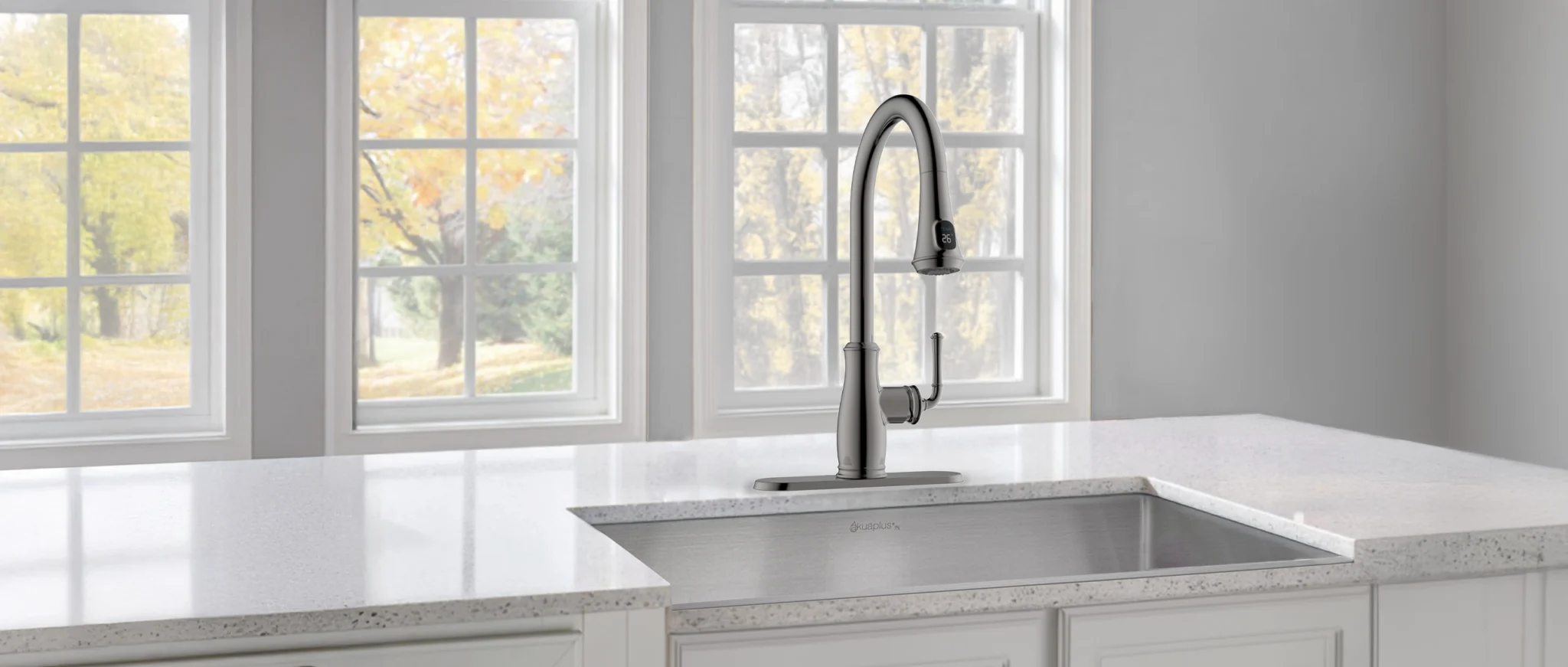 Modern akuaplus® kitchen with a sleek pull-down faucet, stainless steel sink, and bright, minimalist design, showcasing a functional and stylish cooking space.